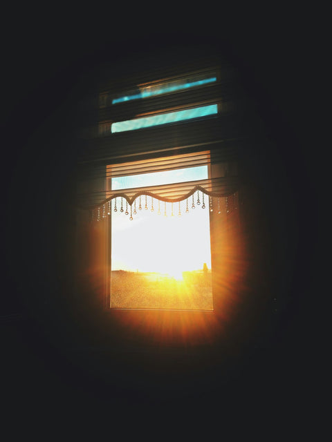 Sunshine streaming through window blinds - why vitamin D matters in the UK